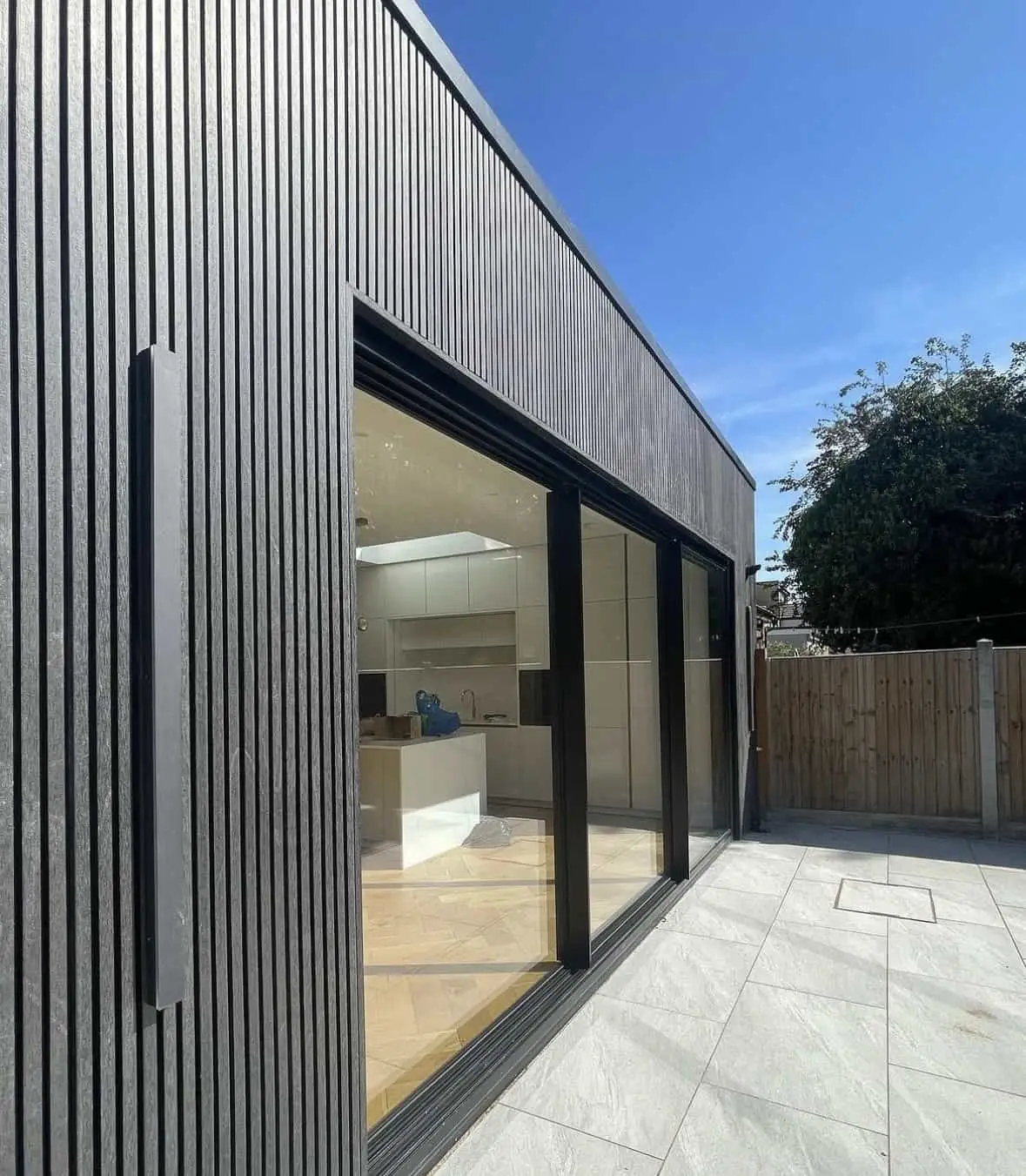 Composite cladding in midnight slatted finish installed by Amber Home Improvements, Norfolk