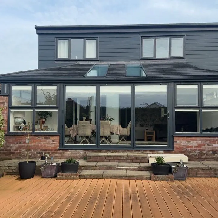 Solid roof conservatory conversion in Caister-on-Sea NR30, anthracite frames and cladding