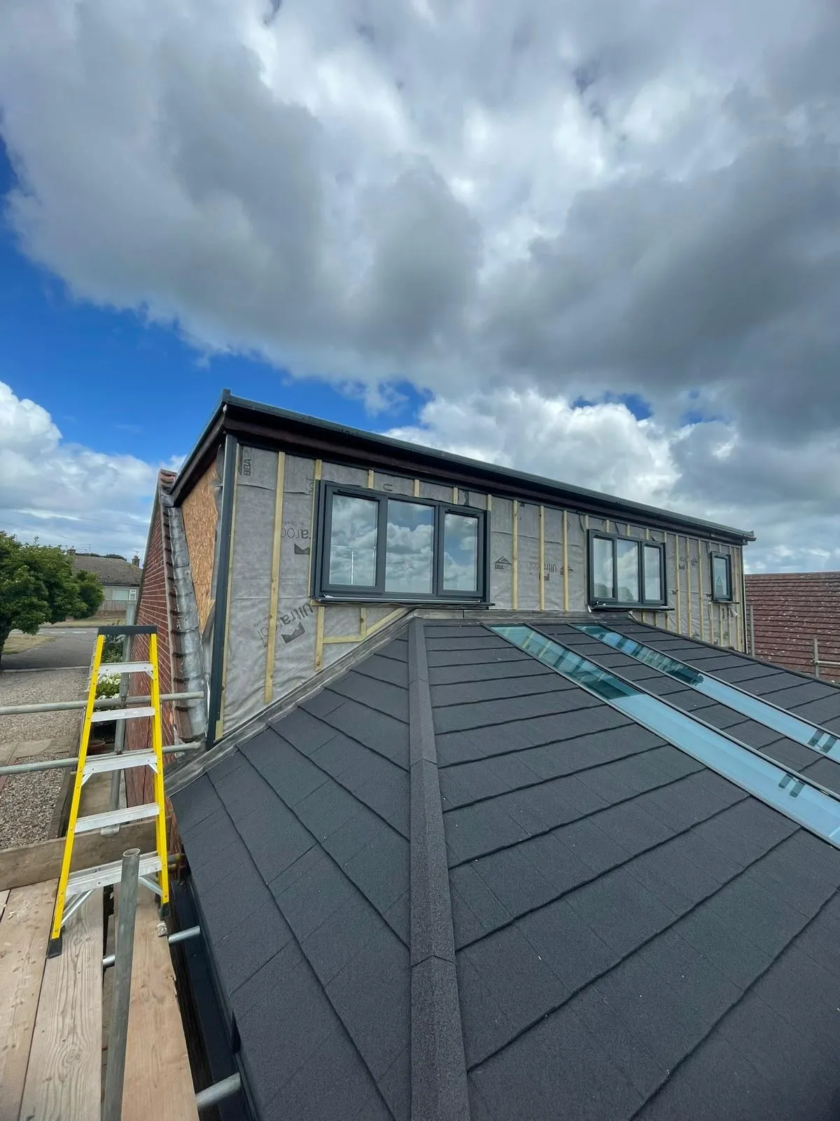 Finished tiled roof with the rear elevation being re-clad behind
