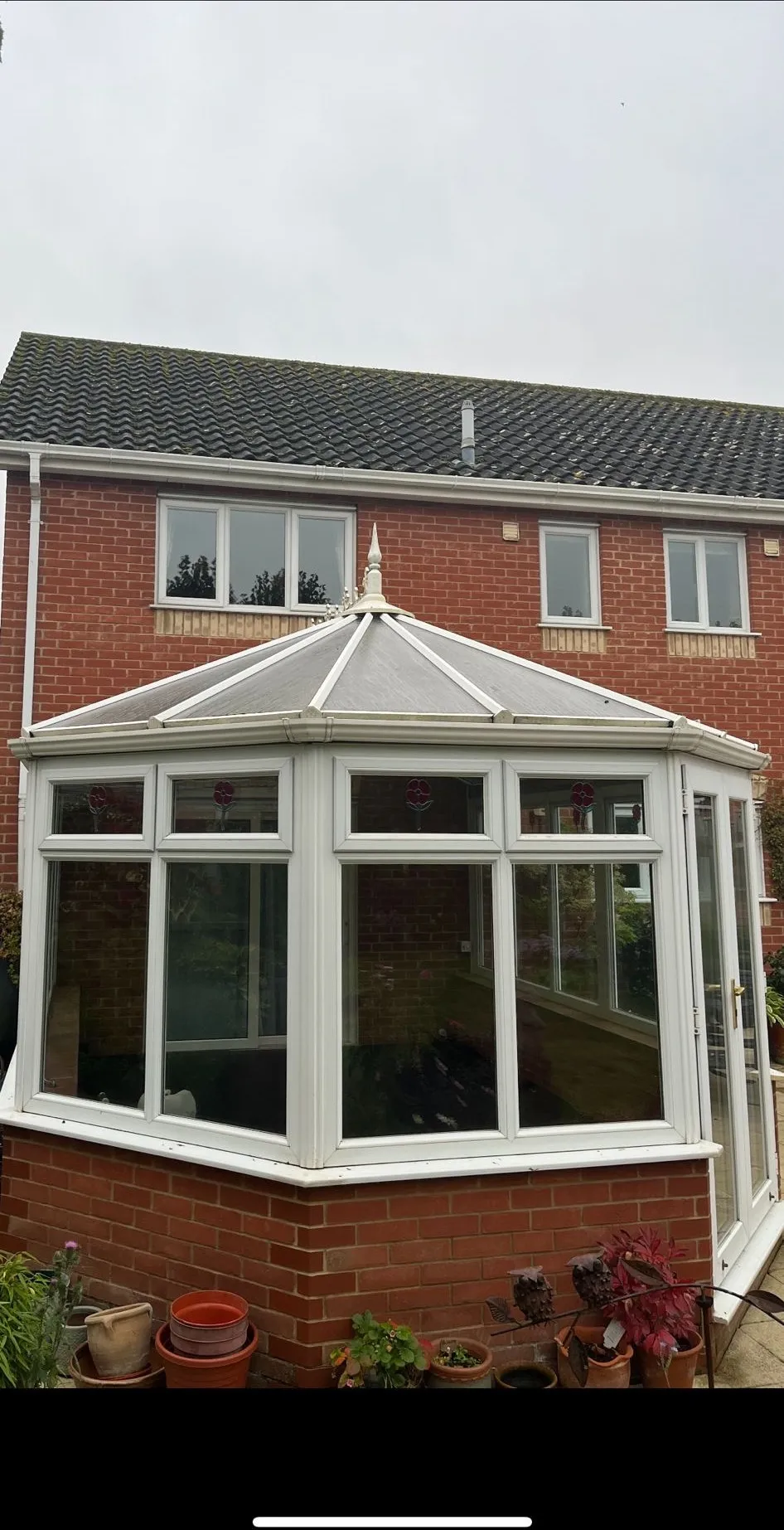 Before: polycarbonate conservatory roof from the patio, Dereham NR20