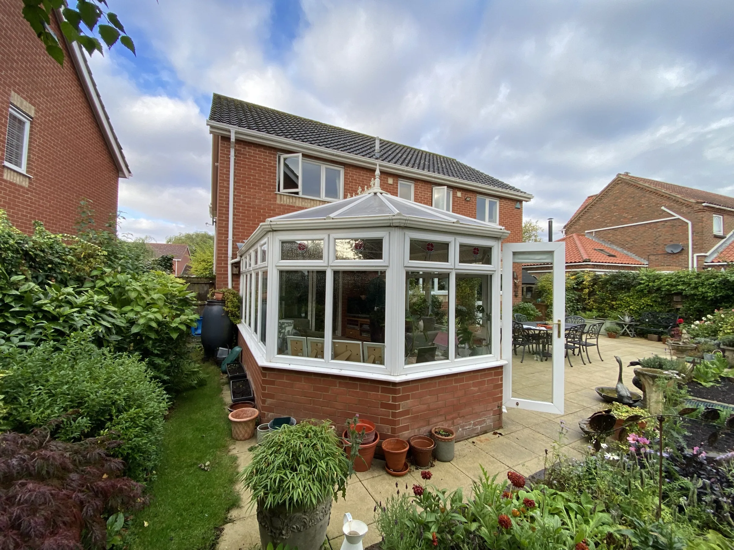 Before: polycarbonate Victorian conservatory rear left elevation, Dereham NR20
