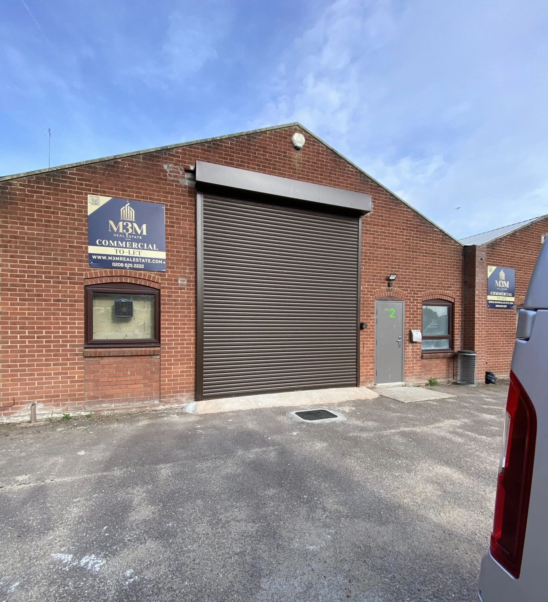 Original roller shutter frontage at Trebles Darts unit in North Walsham, prior to shopfront installation.