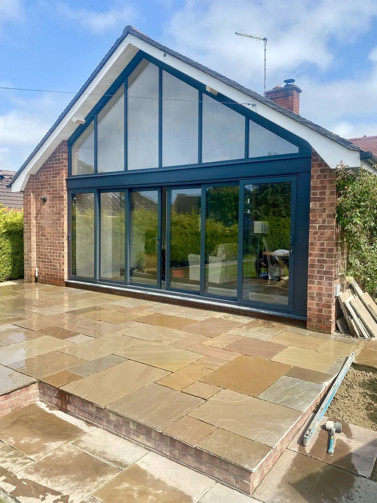 Anthracite aluminium gable glazing with sliding patio doors on a bungalow, Blofield NR13 (gable, not curtain wall)