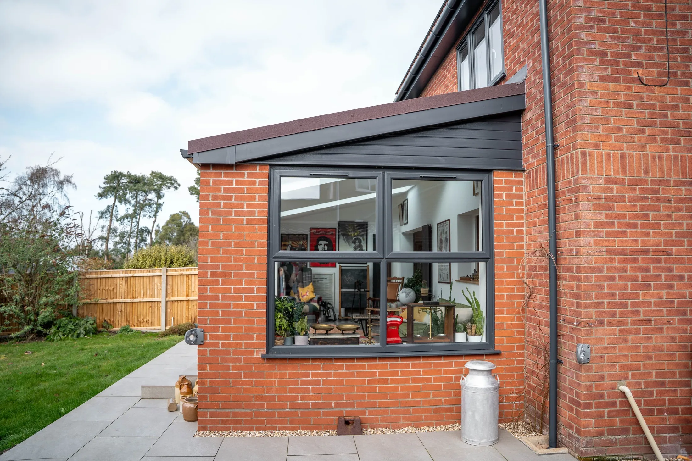 Side of the brick rear extension with a large anthracite window, St Olaves NR31