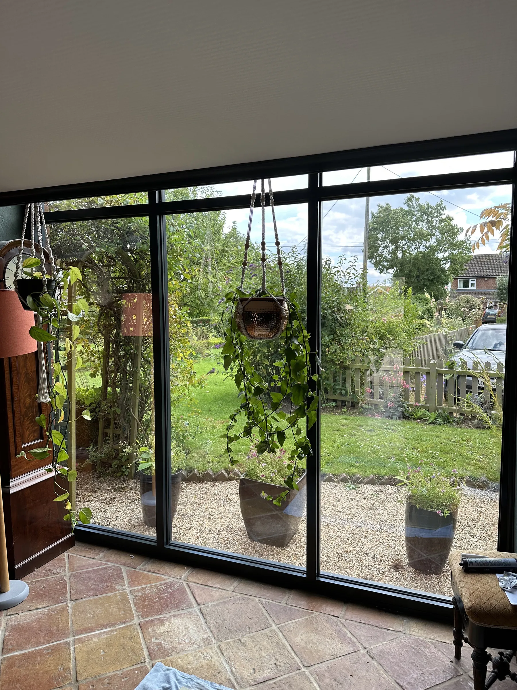 Interior view through aluminium SmartWall curtain walling onto the garden, Welborne NR20