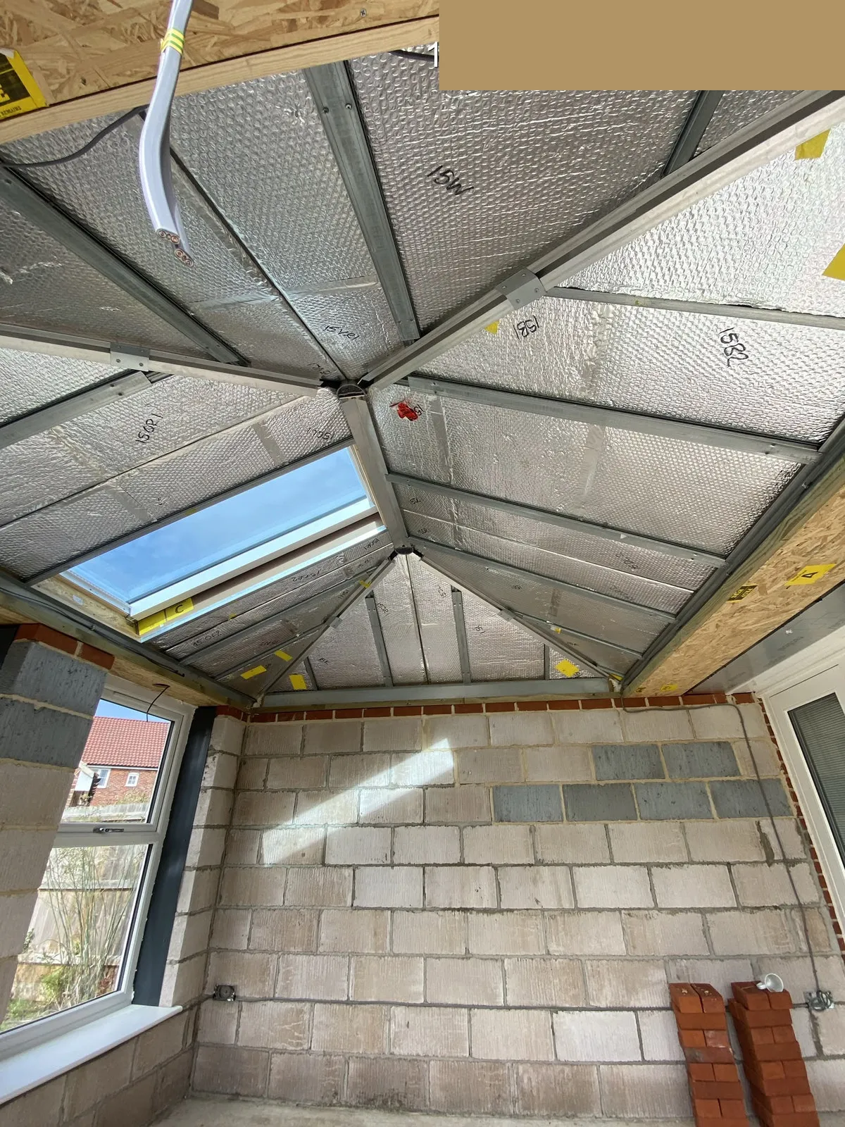 Interior of Ultraroof rear extension showing insulated roof structure and roof light during build, Woodbridge IP13