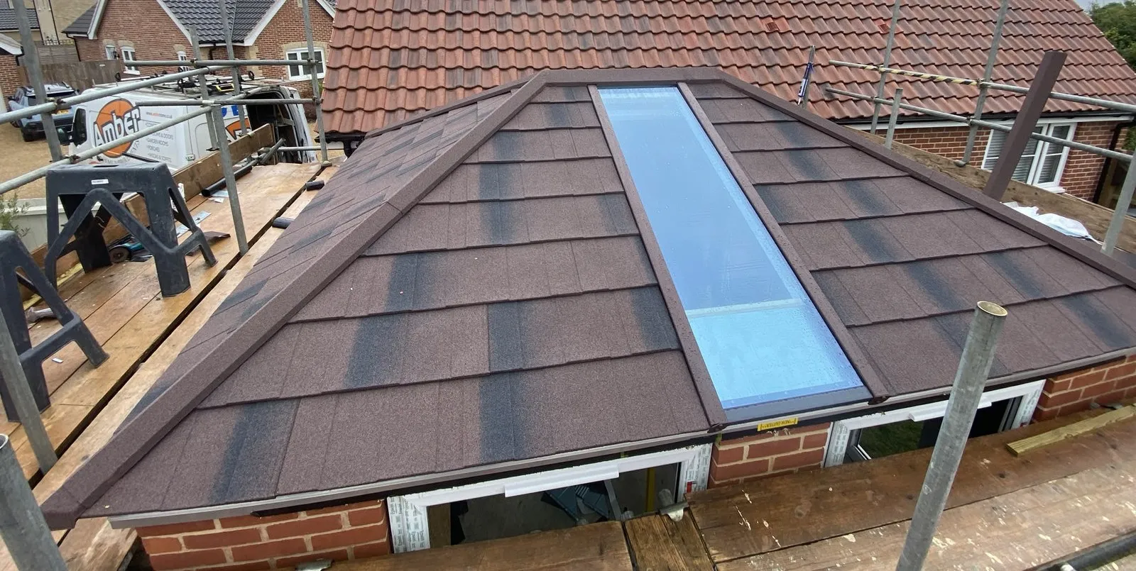 Ultraroof solid tiled hipped roof with rectangular roof light, fitted on a rear extension in Woodbridge IP13, scaffold still up