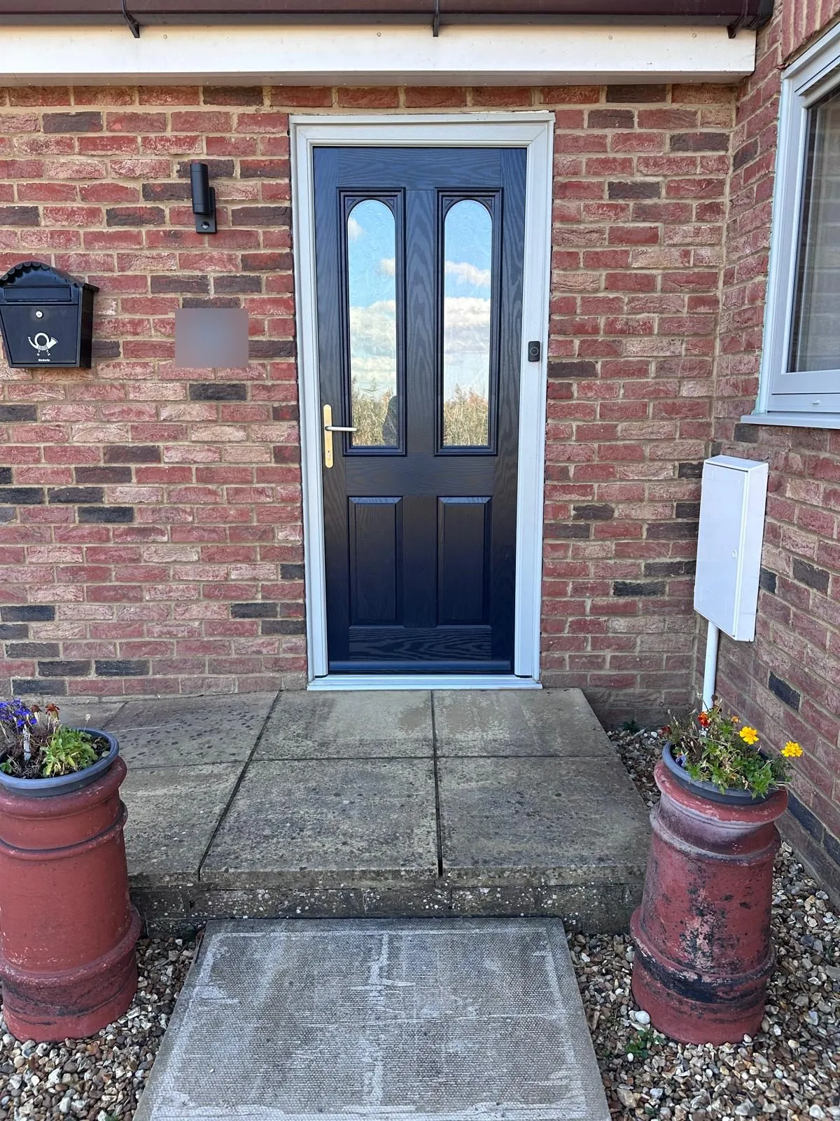 New blue composite front door with curved glazed top panels in an agate grey frame, Downham Market area
