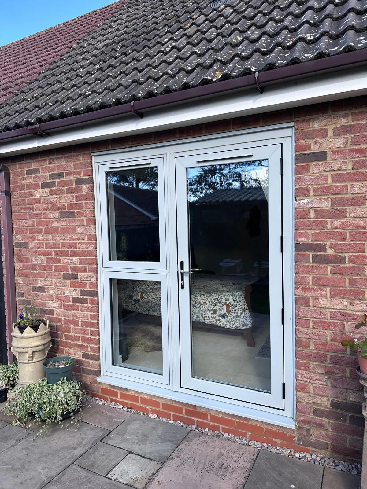 Agate grey glazed flush back door with a matching side window, triple glazed