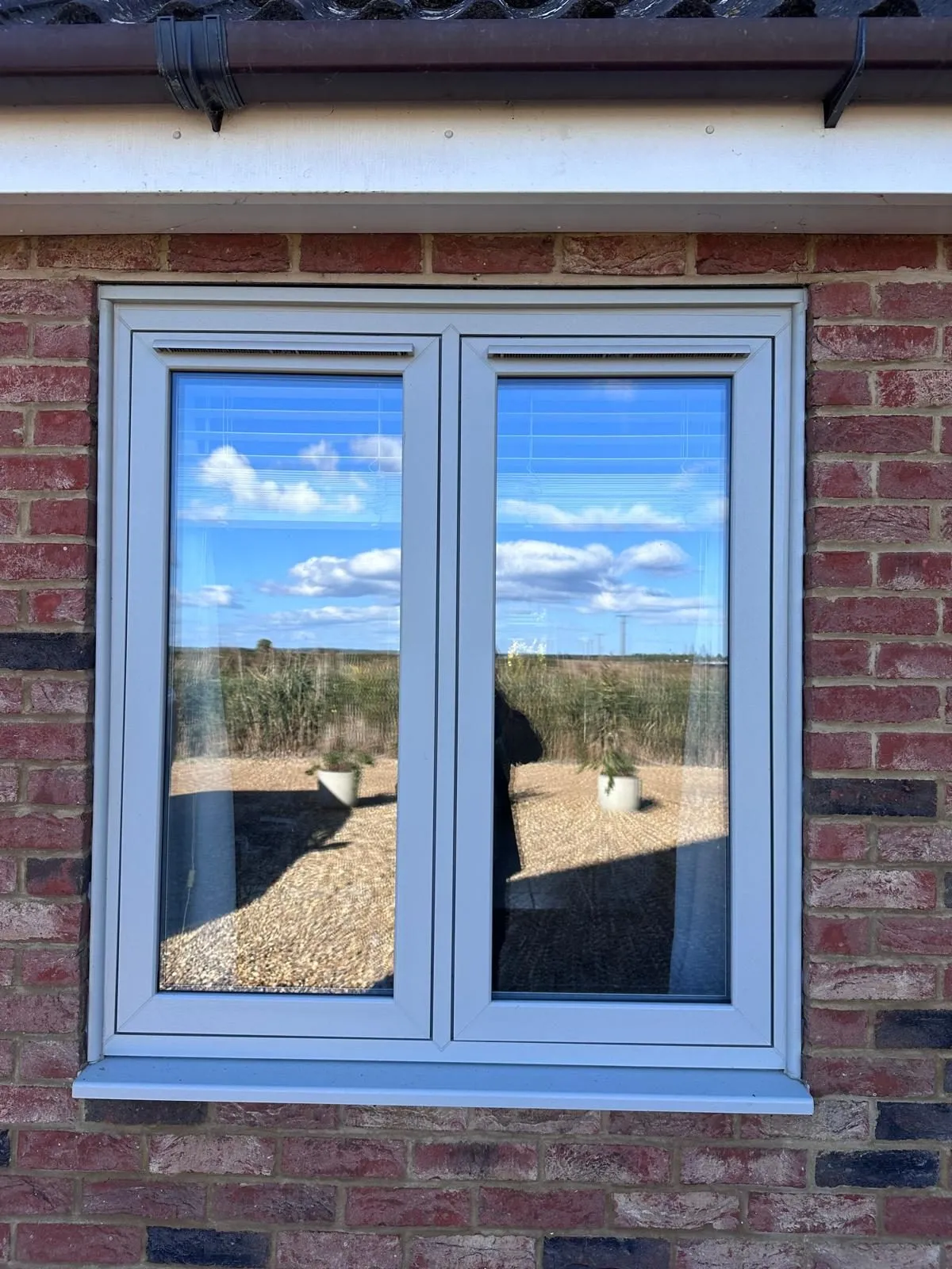 Agate grey flush French casement window with two opening sashes, in the Downham Market area